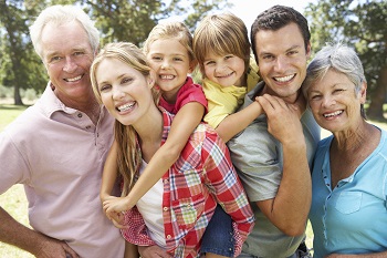 family smiling at camera